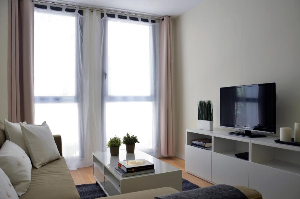 Televízia a/alebo spoločenská miestnosť v ubytovaní SingularStays Comedias