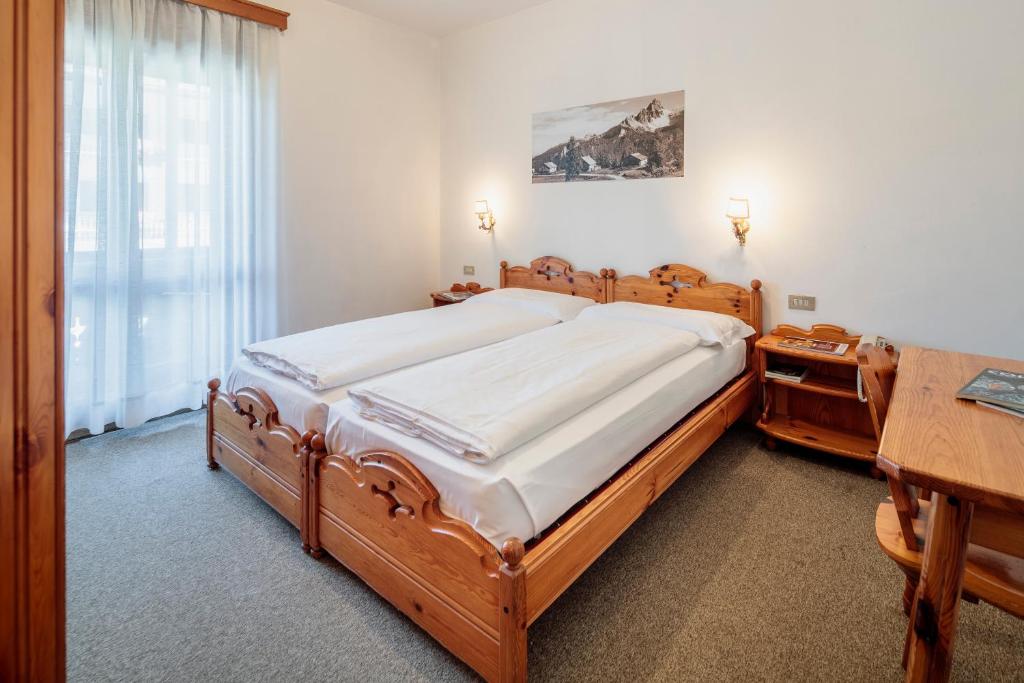 Postel nebo postele na pokoji v ubytování Hotel Al Larin