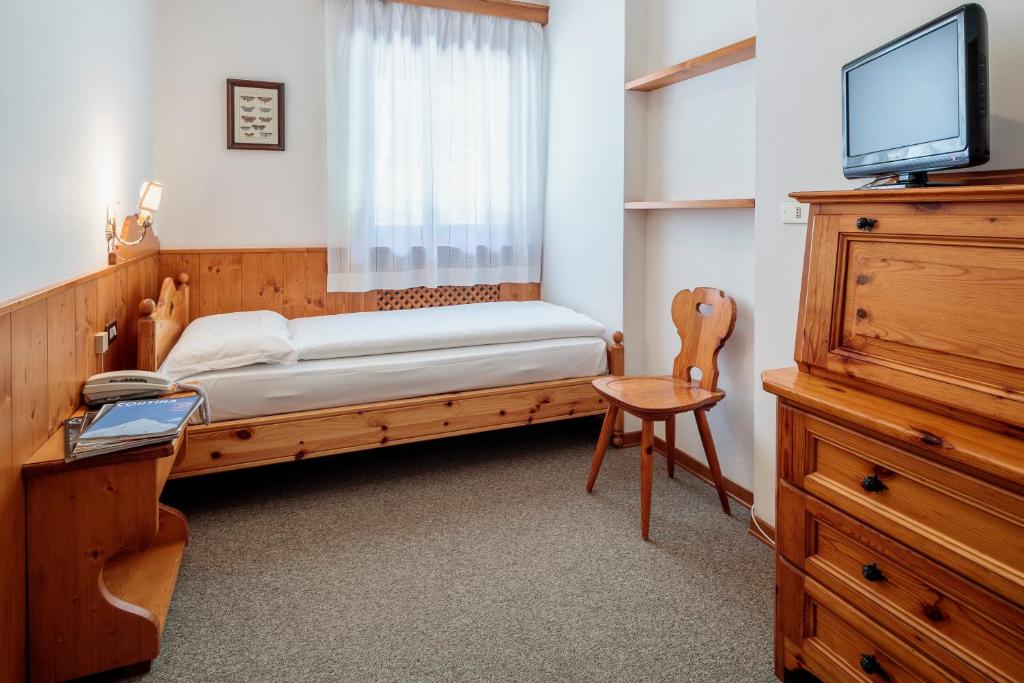 Postel nebo postele na pokoji v ubytování Hotel Al Larin