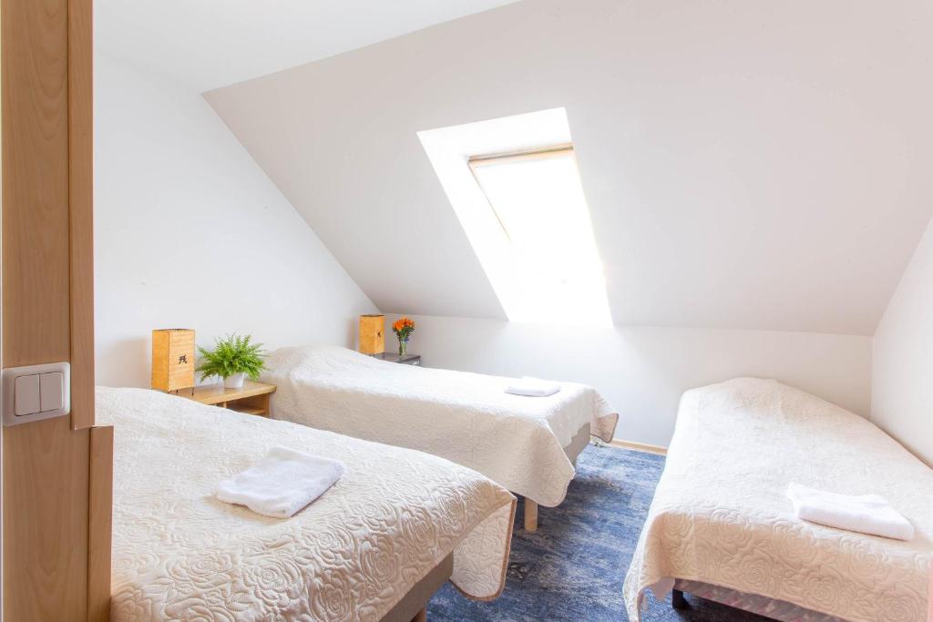 Postel nebo postele na pokoji v ubytování Pärnu Villa Harmony
