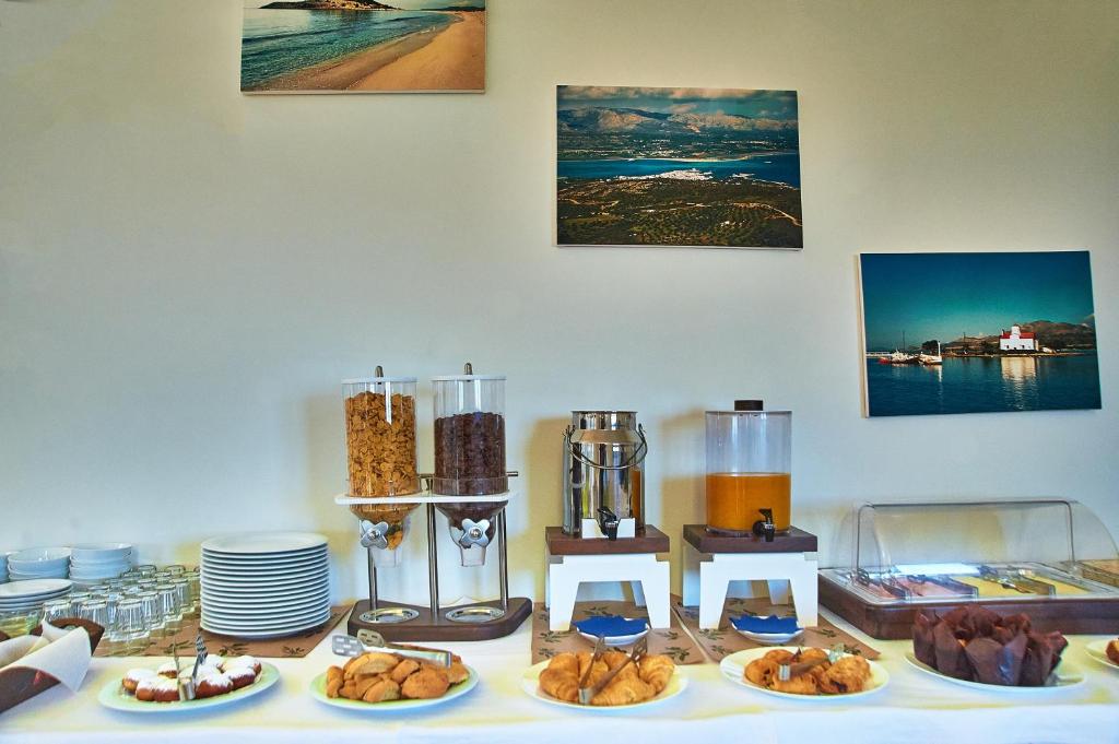 a table topped with plates of food and other foods at Element Hotel in Elafonisos