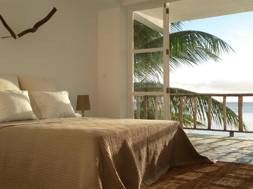 Postel nebo postele na pokoji v ubytování Bliss Boutique Hotel Seychelles