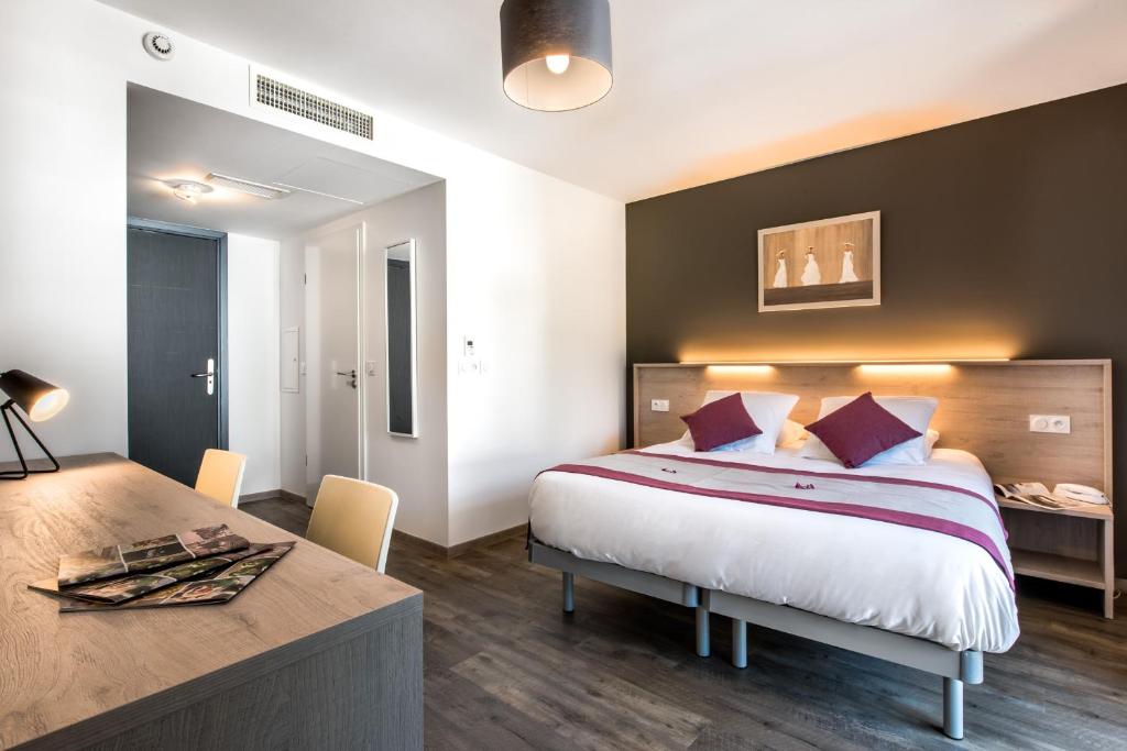 Postel nebo postele na pokoji v ubytování Hotel du Grand Parc