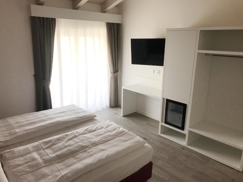 Posteľ alebo postele v izbe v ubytovaní Maso Tobel Riva del Garda