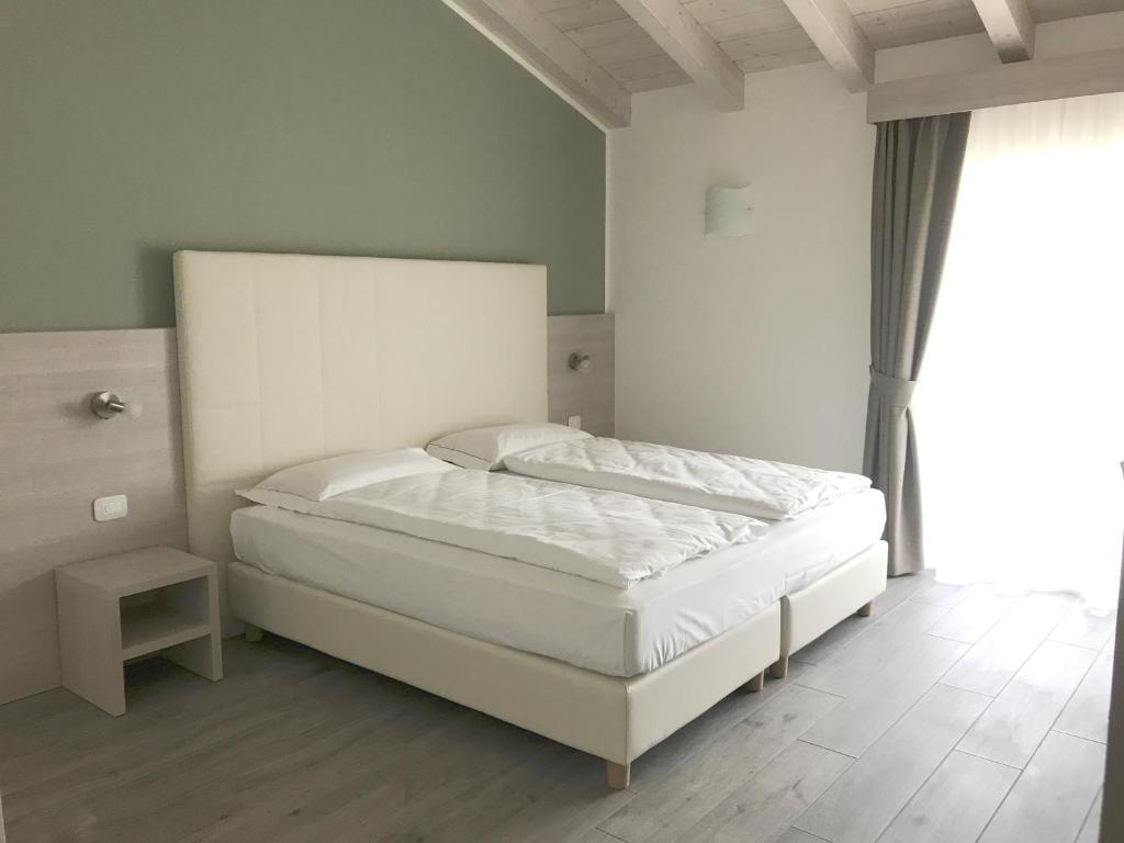 Posteľ alebo postele v izbe v ubytovaní Maso Tobel Riva del Garda