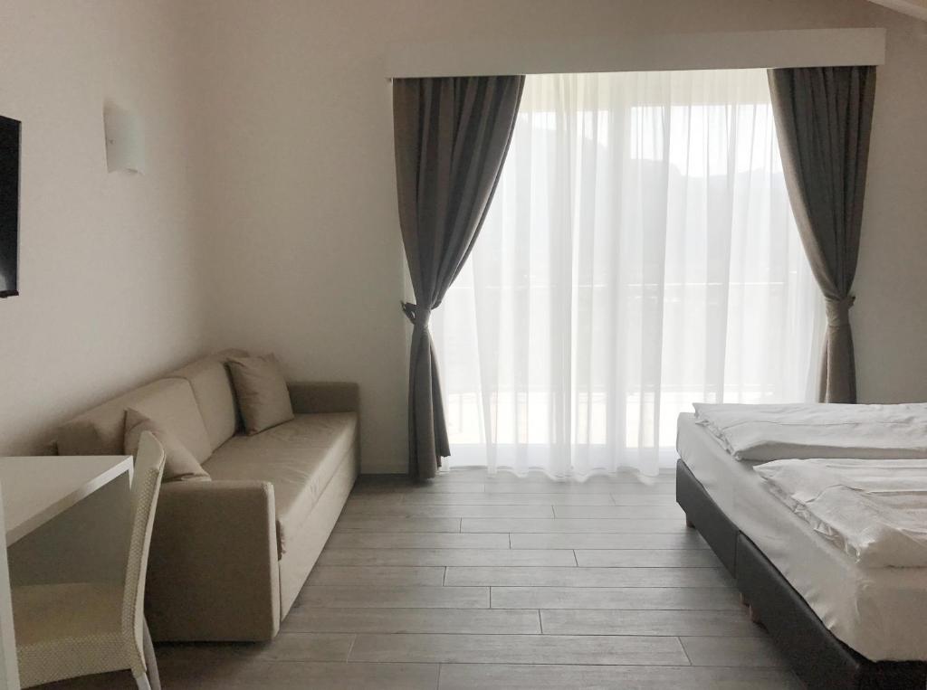 Posteľ alebo postele v izbe v ubytovaní Maso Tobel Riva del Garda