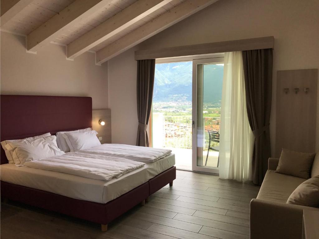 Posteľ alebo postele v izbe v ubytovaní Maso Tobel Riva del Garda