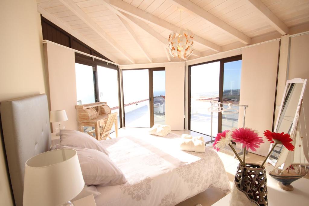 a bedroom with a bed with a view of the ocean at Loft Sunset View, Costa Adeje in Adeje