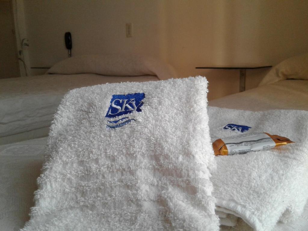 Кровать или кровати в номере Hotel SKY
