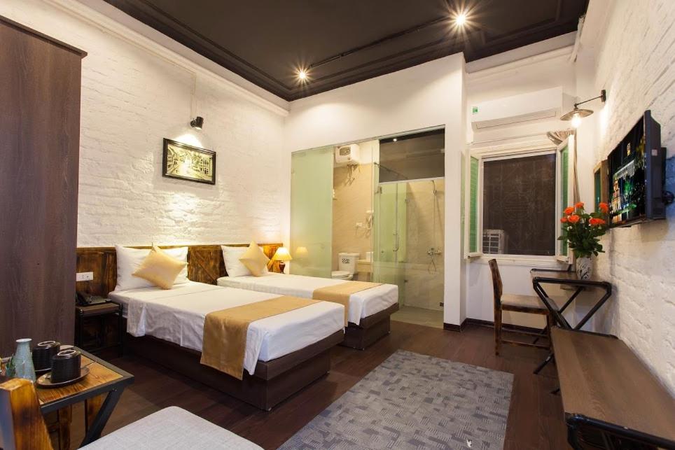 Postel nebo postele na pokoji v ubytování Luxury Backpakers Hotel