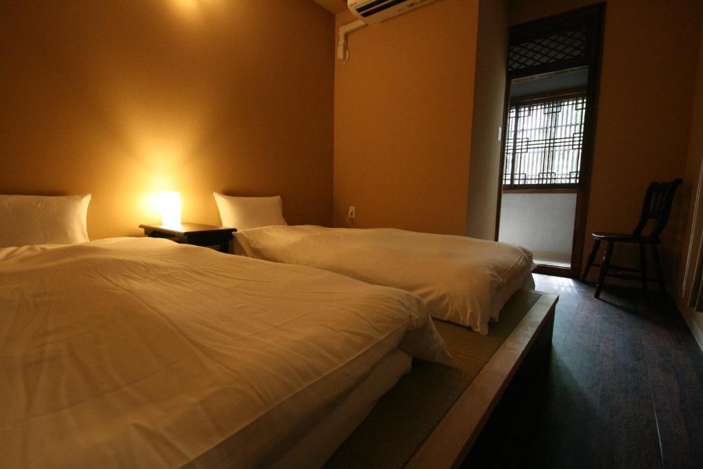 Letto o letti in una camera di HARUYA Naramachi
