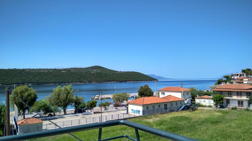 a view of the water from the balcony of a house at Nikolitsa Apartments in Glyfada Fokidas