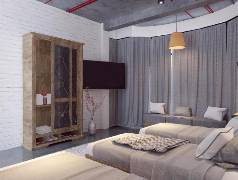 Postel nebo postele na pokoji v ubytování Luxury Backpakers Hotel