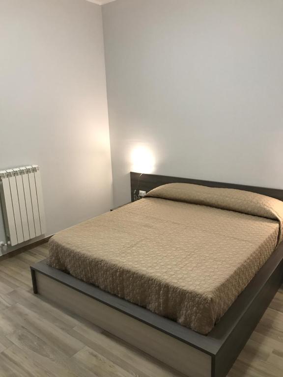 Ένα ή περισσότερα κρεβάτια σε δωμάτιο στο Il Vecchio Cotonificio