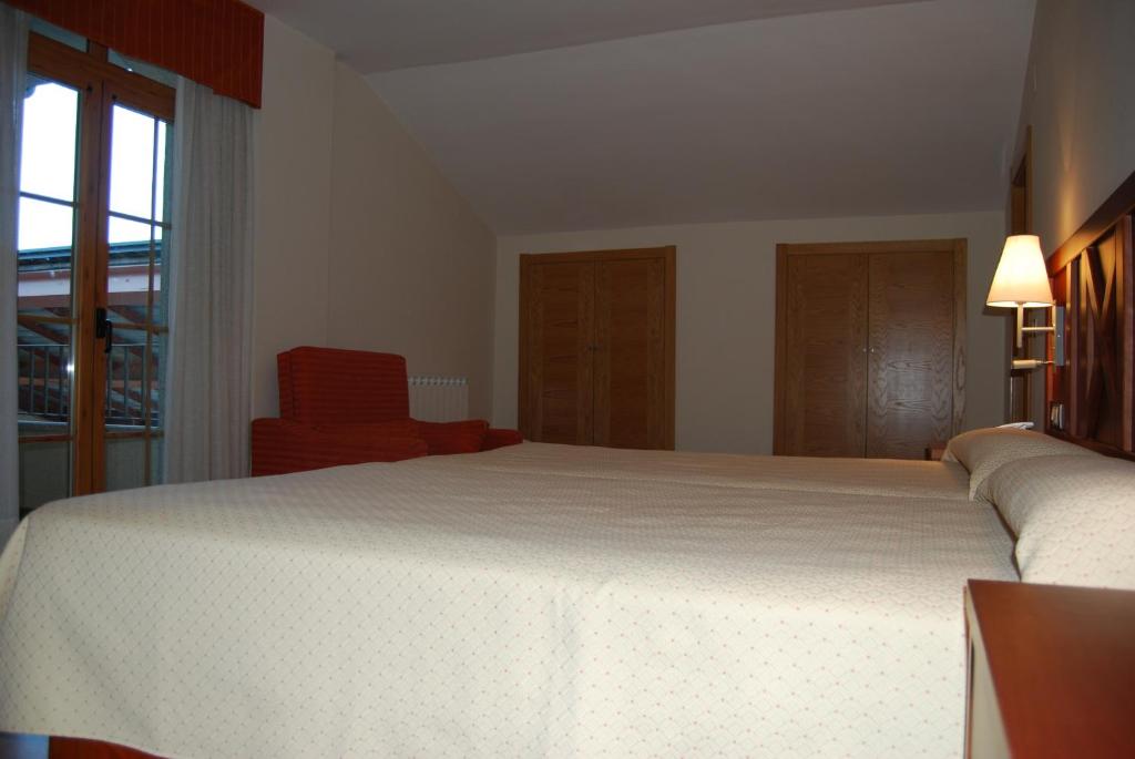 Postel nebo postele na pokoji v ubytování Hotel Meleiros