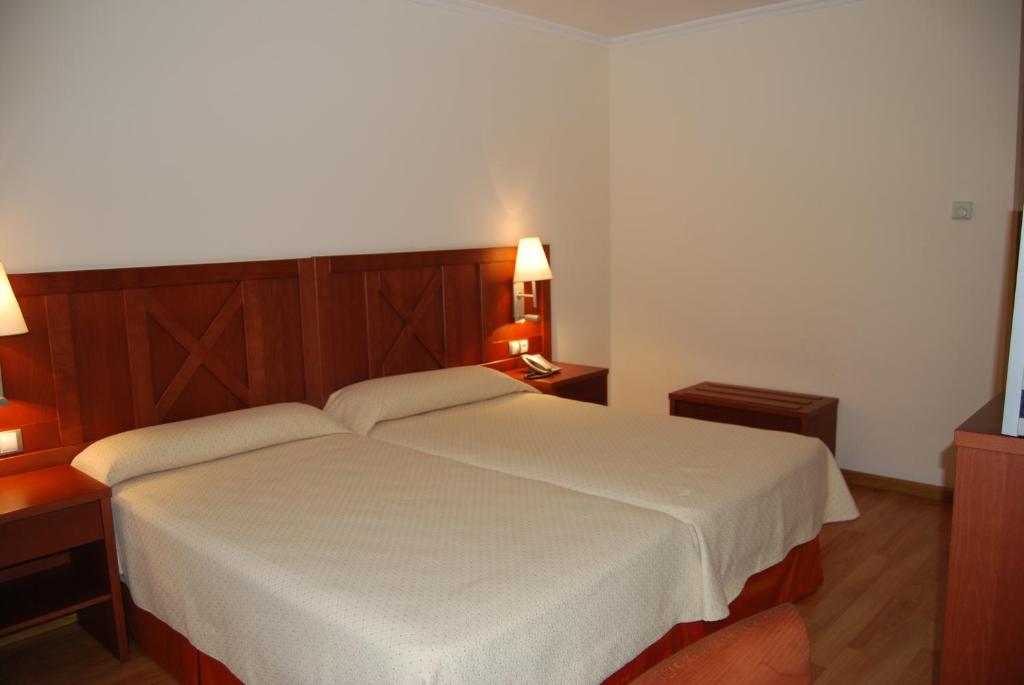 Postel nebo postele na pokoji v ubytování Hotel Meleiros