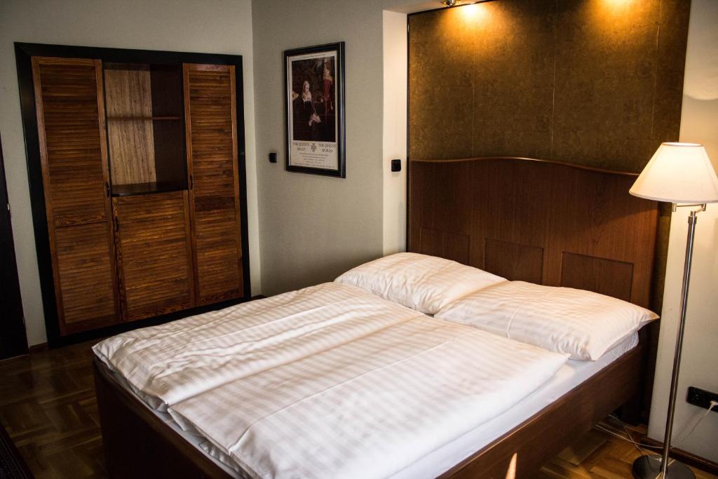 Postel nebo postele na pokoji v ubytování Hotel Continental