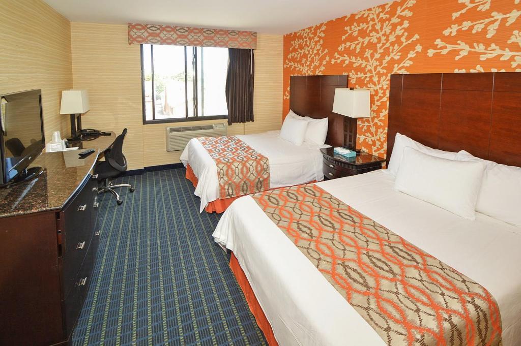Postel nebo postele na pokoji v ubytování Corona Hotel New York - LaGuardia Airport