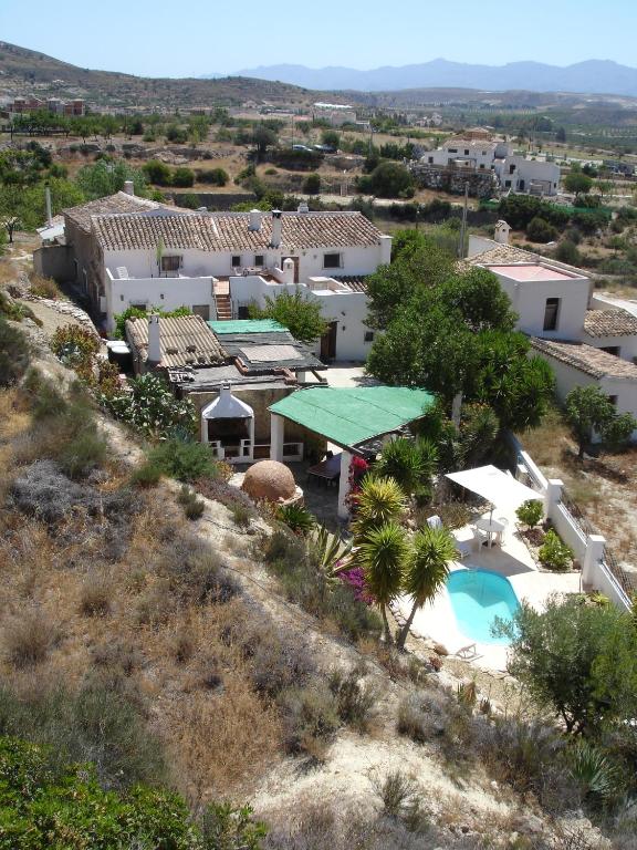 an aerial view of a house with a swimming pool at Almond Reef Casa Rural in Los Alias