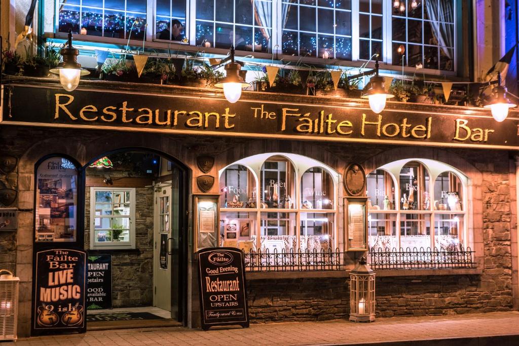 a restaurant with a sign that reads restaurant the false hotel bar at Failte Hotel in Killarney