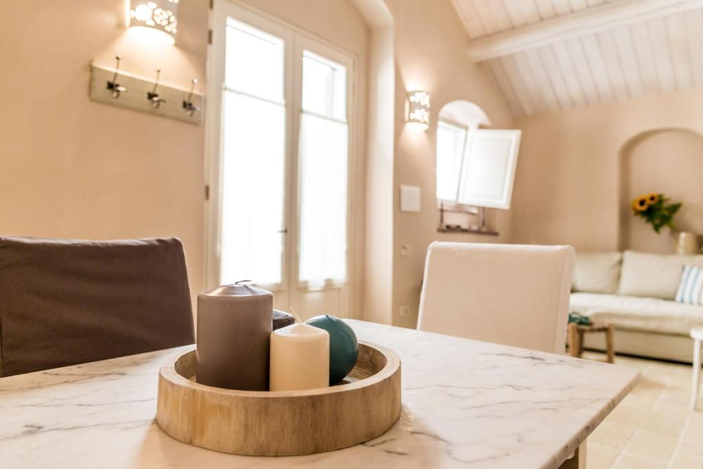 a dining room with a table with candles on it at Borgo San Gaetano in Bernalda