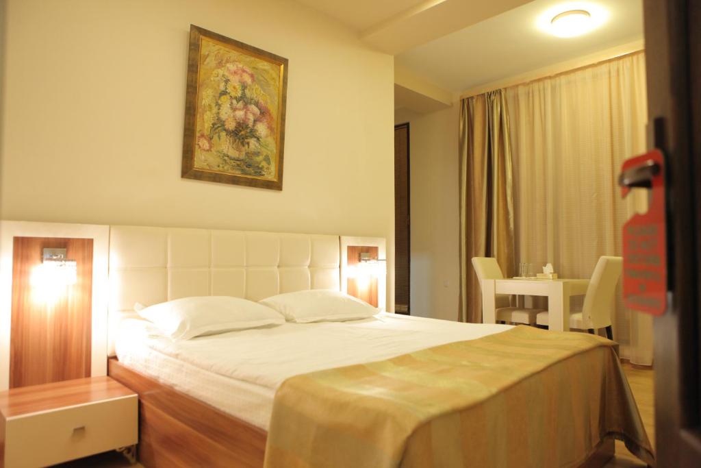 a bedroom with a large bed in a room at Daniel Boutique Hotel in Yerevan