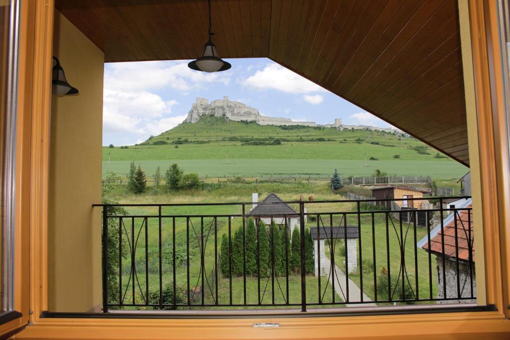 a window with a view of a mountain at Penzion Chalupka II in Spišské Podhradie