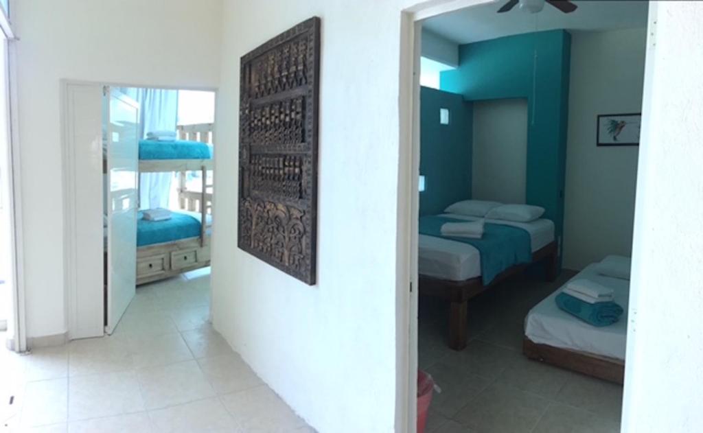 Postel nebo postele na pokoji v ubytování Hostal Bucerias