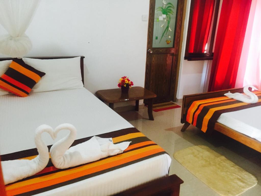 Postel nebo postele na pokoji v ubytování Disna Homestay