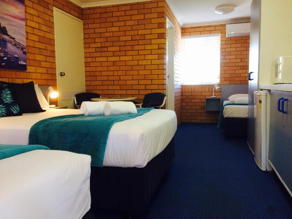 Postel nebo postele na pokoji v ubytování Bosuns Inn Motel