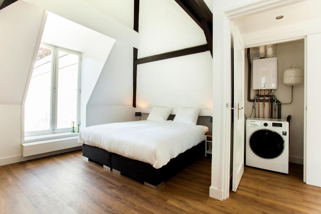 Postel nebo postele na pokoji v ubytování Stayci Serviced Apartments Royal Palace