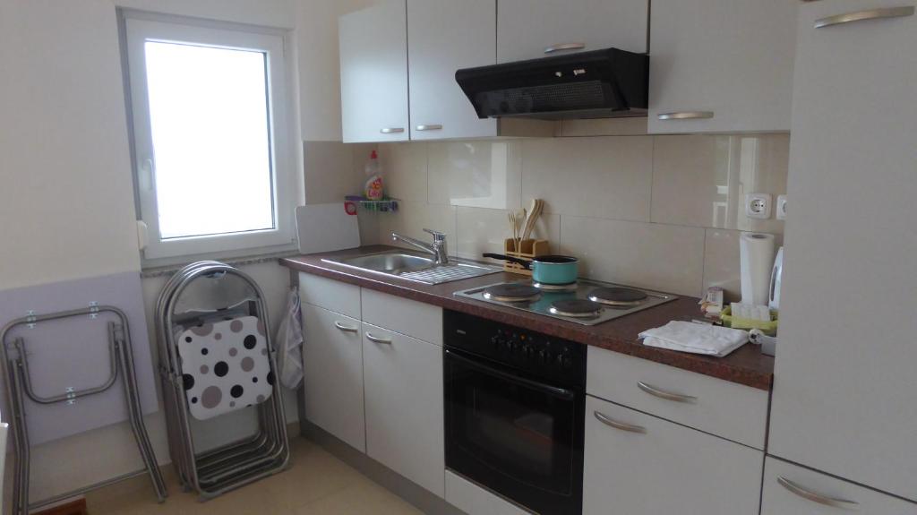 Kuchyňa alebo kuchynka v ubytovaní Maison Brelavista