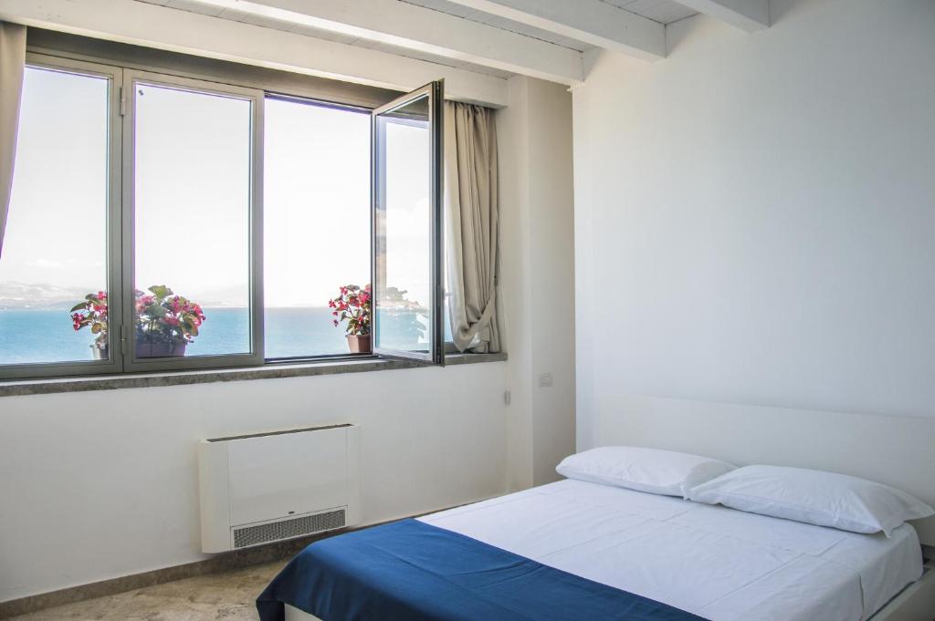 Posteľ alebo postele v izbe v ubytovaní Sunrise Guest House
