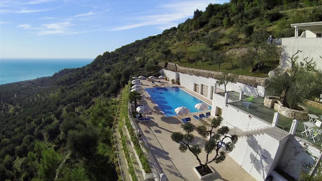 an aerial view of a building with a swimming pool at Residence Montelci in Mattinata