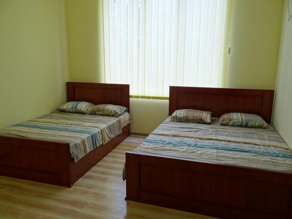 Postel nebo postele na pokoji v ubytování Blue Star