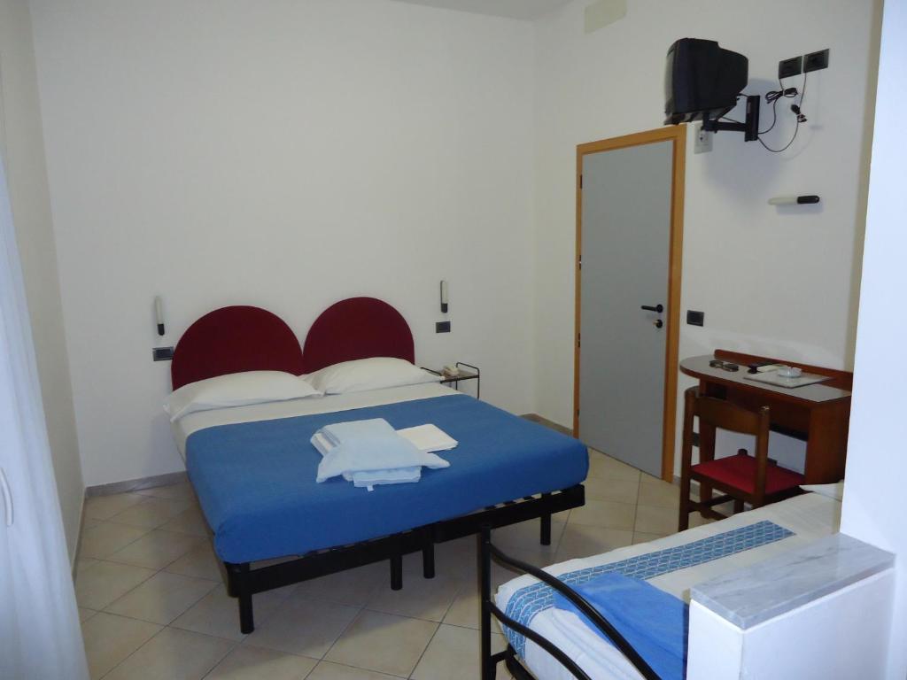 Postel nebo postele na pokoji v ubytování Hotel L&V
