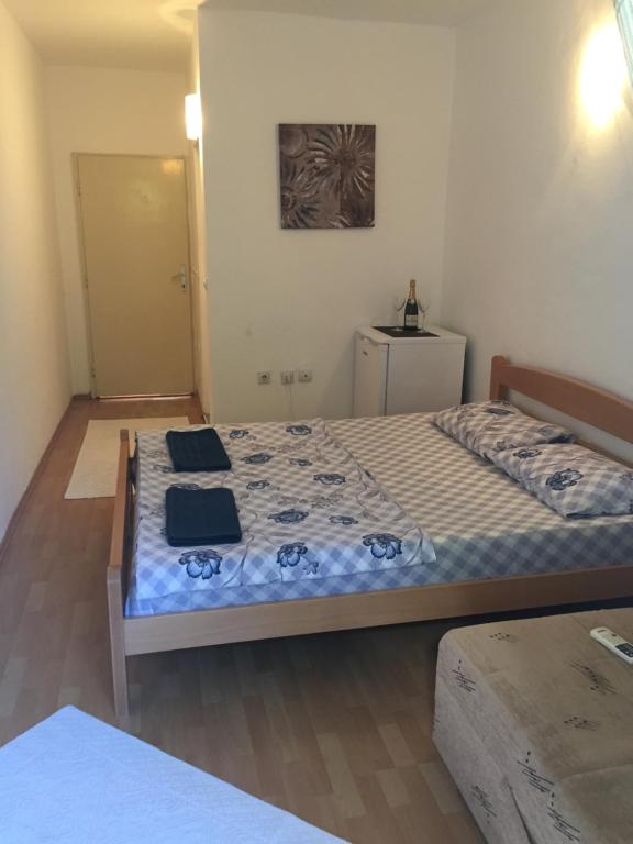 Postel nebo postele na pokoji v ubytování Tina Rooms