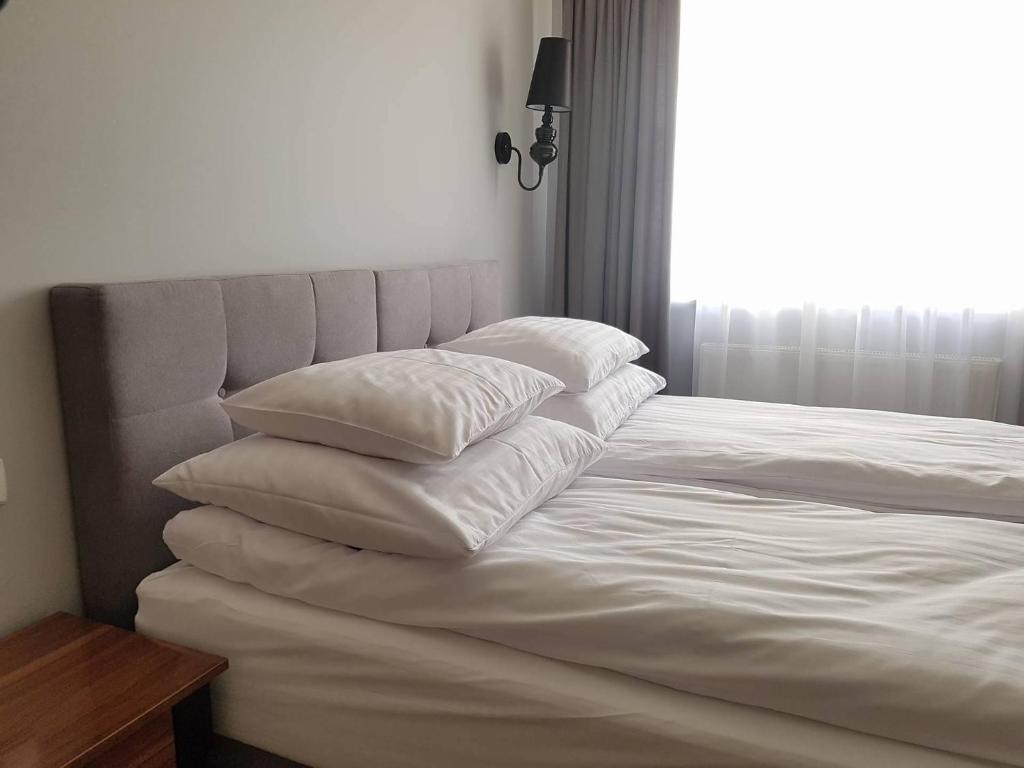 Posteľ alebo postele v izbe v ubytovaní Pokoje Amore Residence
