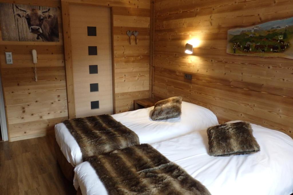 Postel nebo postele na pokoji v ubytování Hôtel Viallet