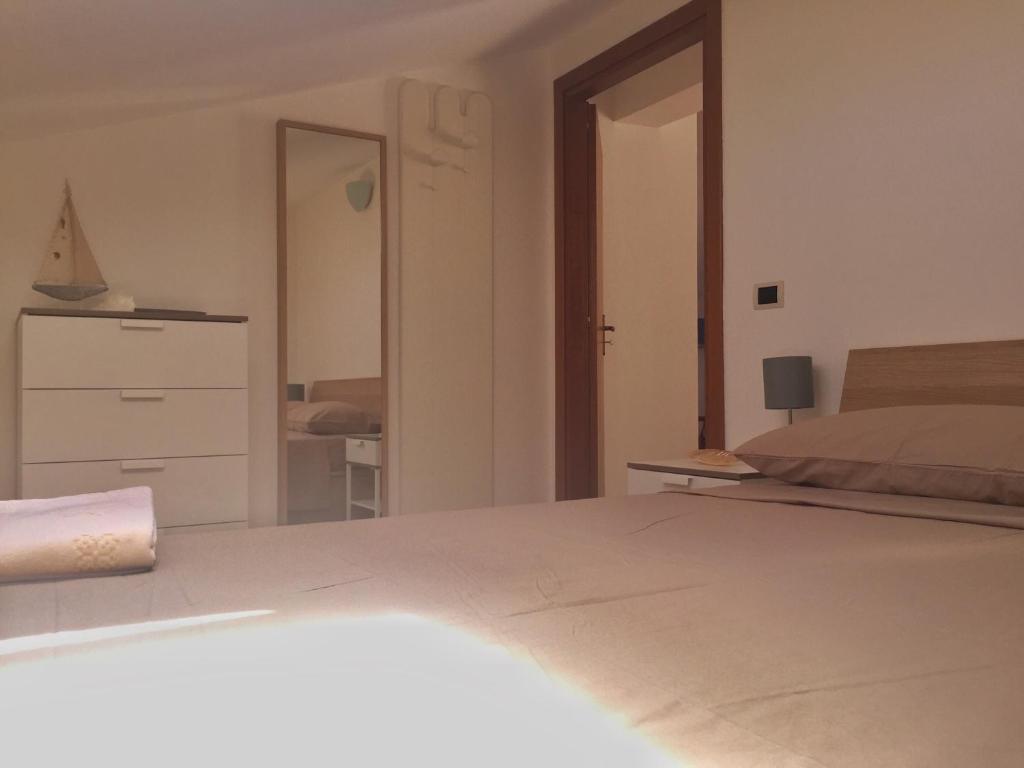 Postel nebo postele na pokoji v ubytování Suite sul mare