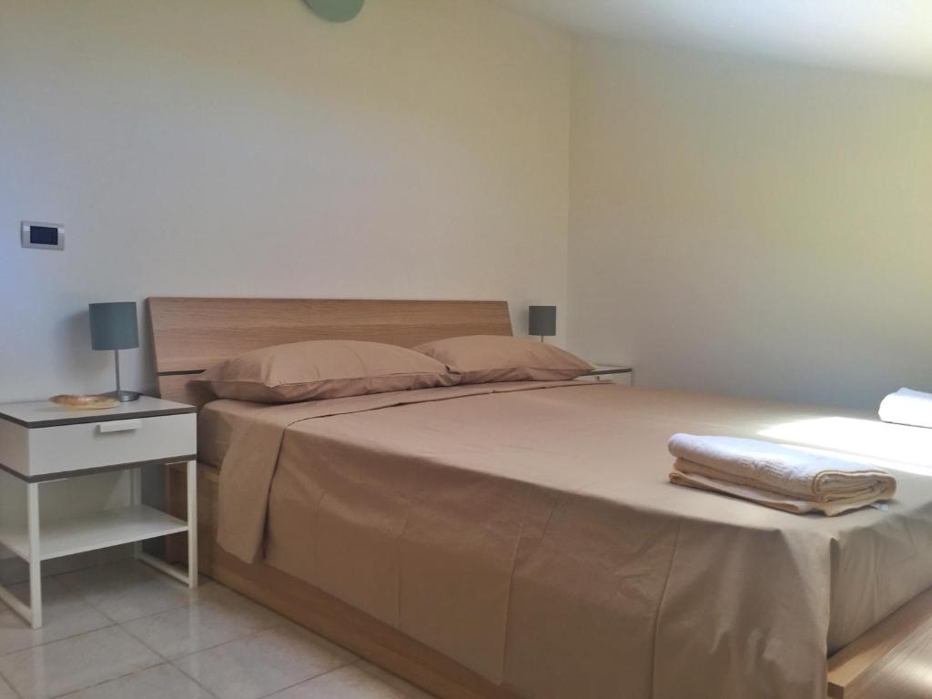Postel nebo postele na pokoji v ubytování Suite sul mare
