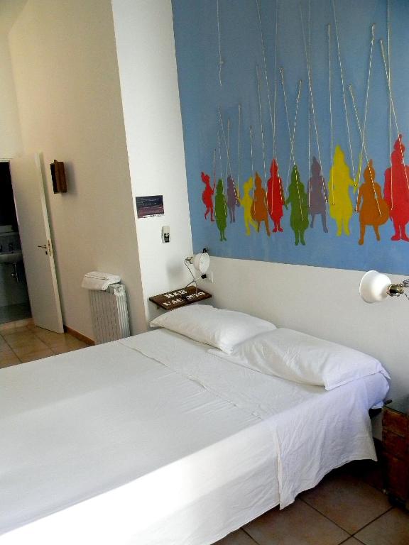 Postel nebo postele na pokoji v ubytování L'Acanto