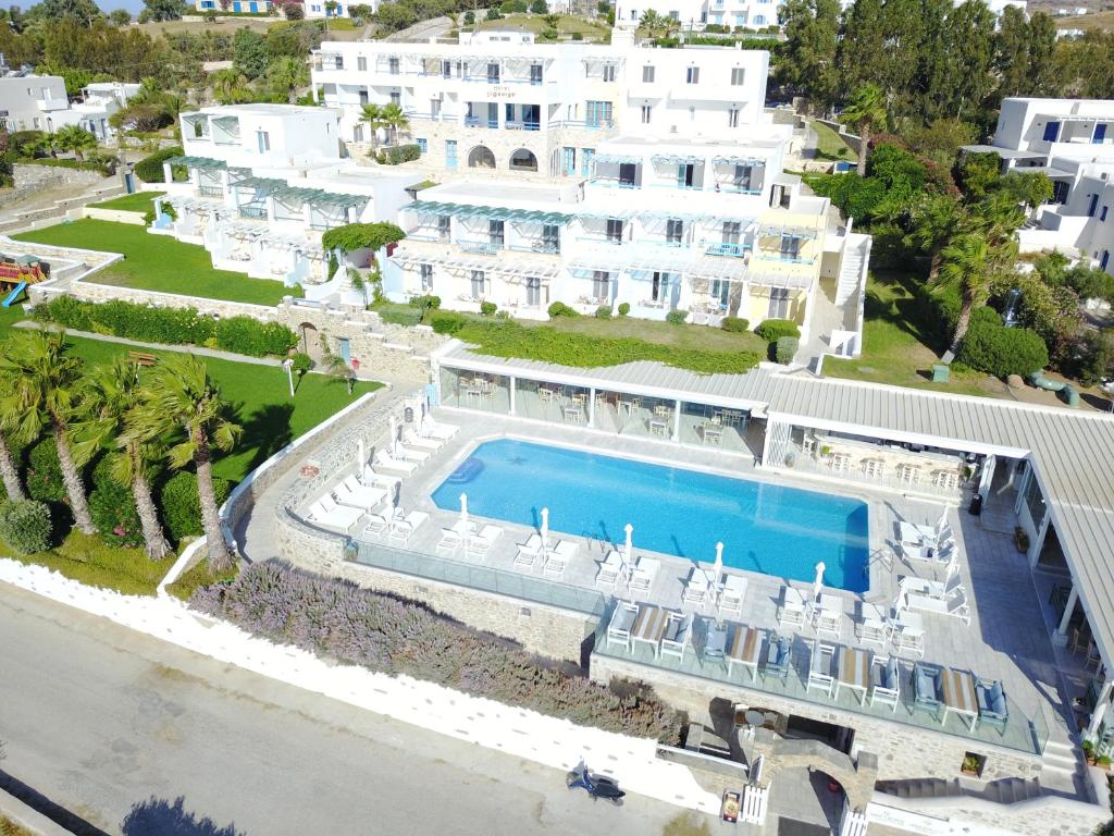 an aerial view of a large white building with a swimming pool at Saint George Hotel in Chrissi Akti