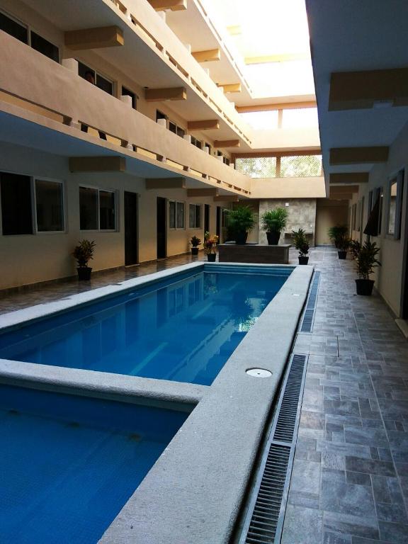 Bazén v ubytování Hotel Puerto Inn nebo v jeho okolí