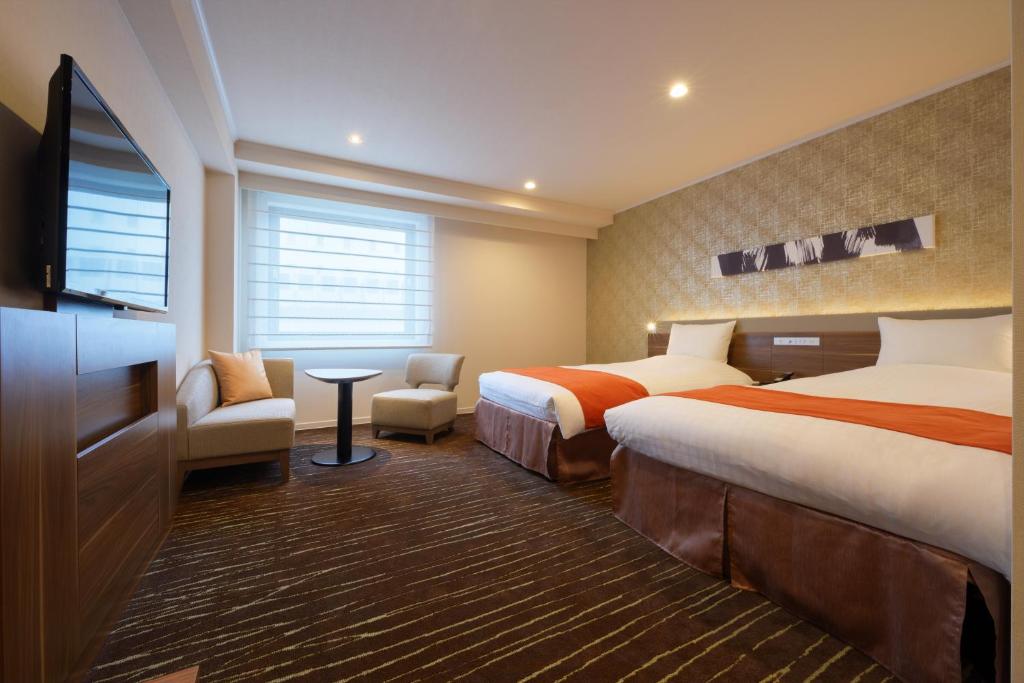 Posteľ alebo postele v izbe v ubytovaní Hotel JAL City Sendai