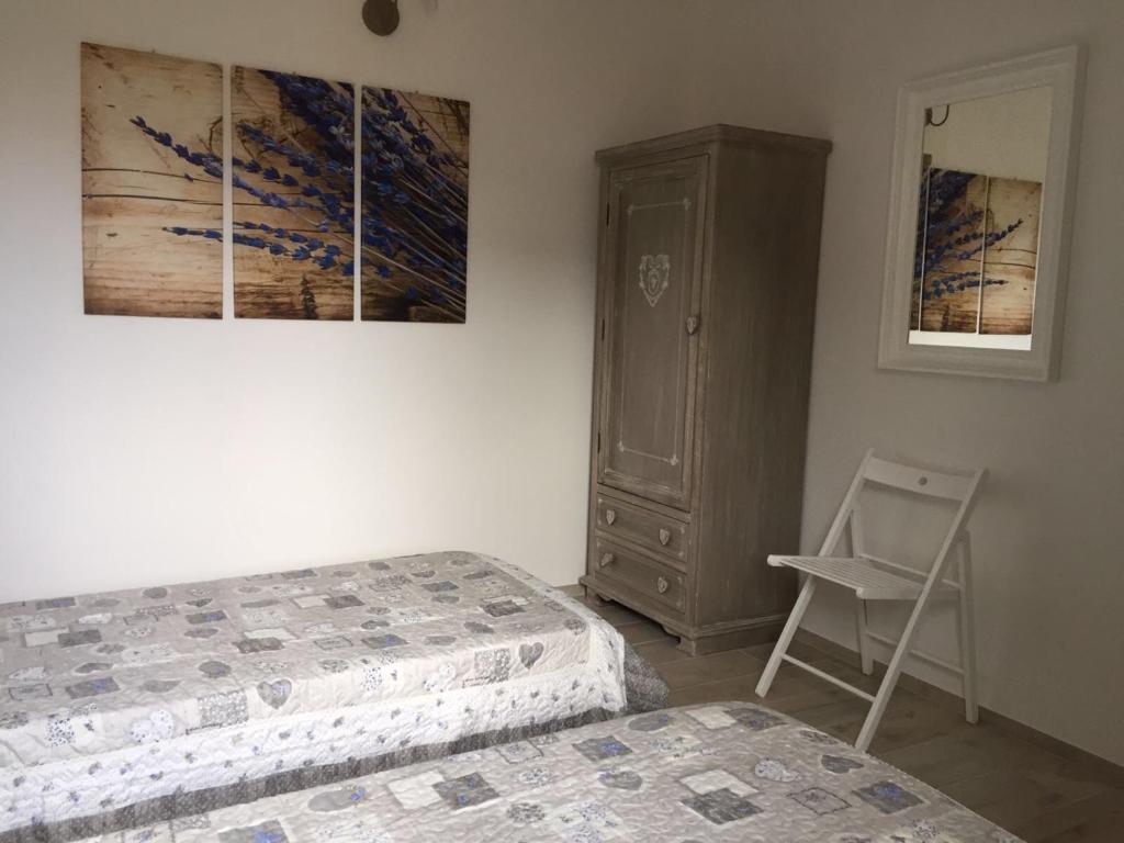 Postel nebo postele na pokoji v ubytování Casetta Lavanda