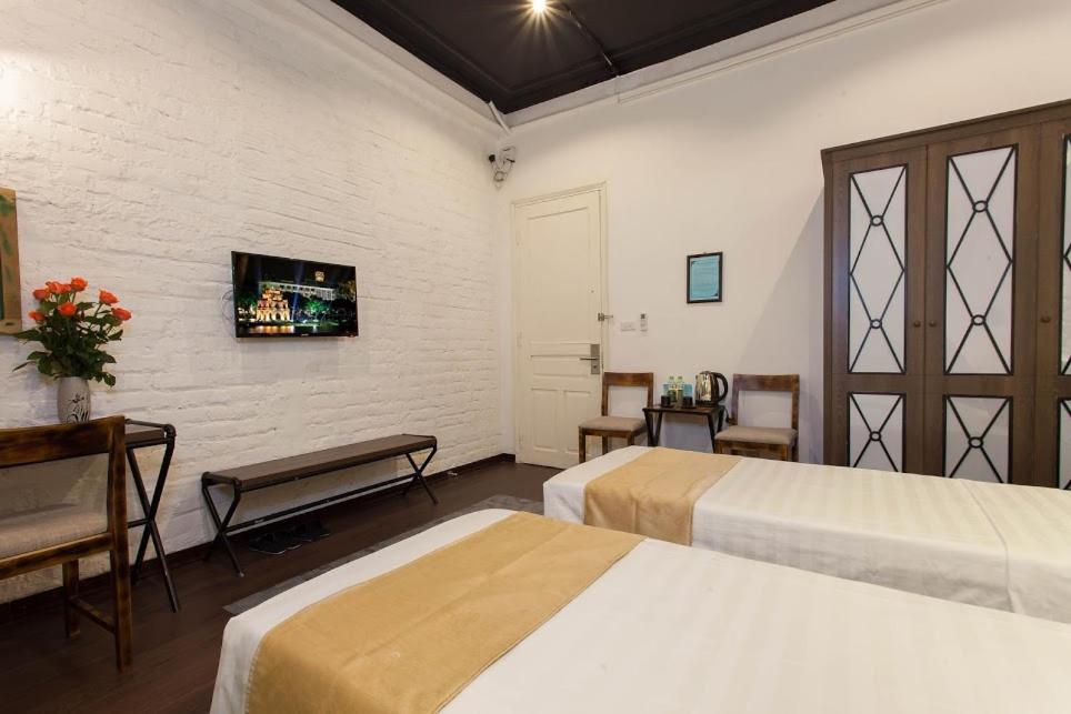 Postel nebo postele na pokoji v ubytování Luxury Backpakers Hotel
