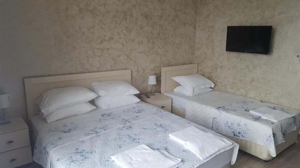 Postel nebo postele na pokoji v ubytování Hotel Del Mar