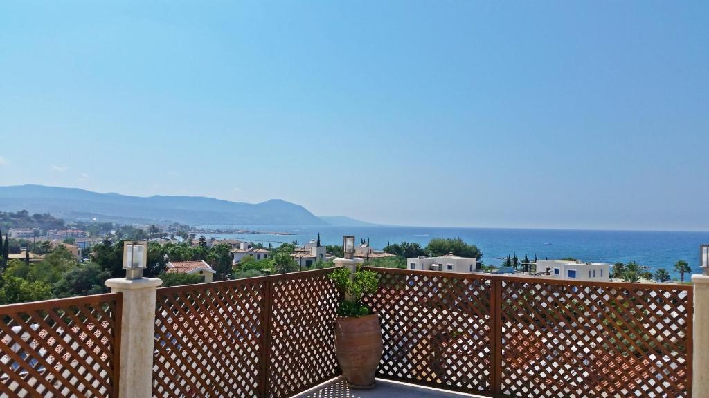 a balcony with a view of the ocean at Acropolis Sea View Villa in Polis Chrysochous