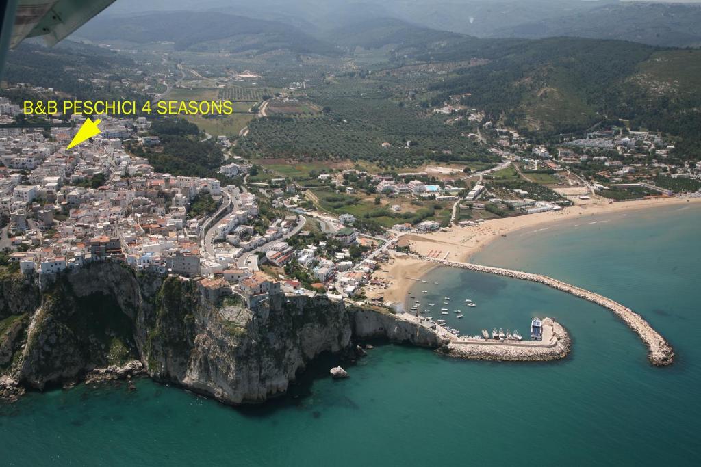 an aerial view of a beach next to the ocean at B&B Peschici 4 Stagioni in Peschici